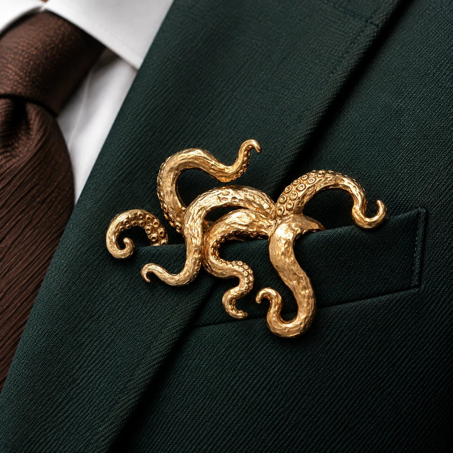 Gold octopus accessory on green suit