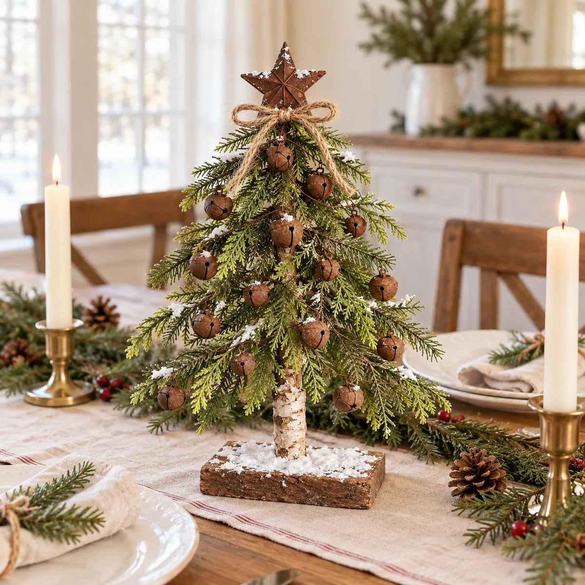 Bells and Starlight Christmas tree displayed on a festive dining table
